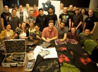 Visceral Games team with auction items photo Visceral Games team with auction items photo